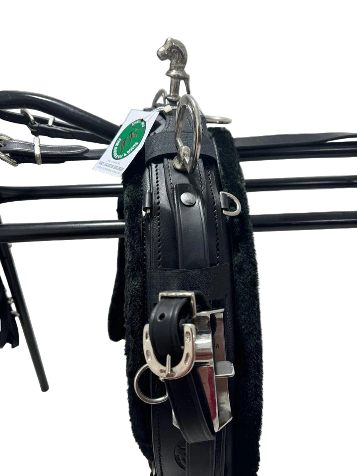 Black leather bridle with metal hardware on a white background