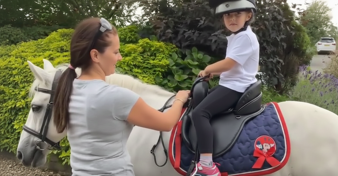 Child riding with Versatile Apex Saddle showing stability and correct support