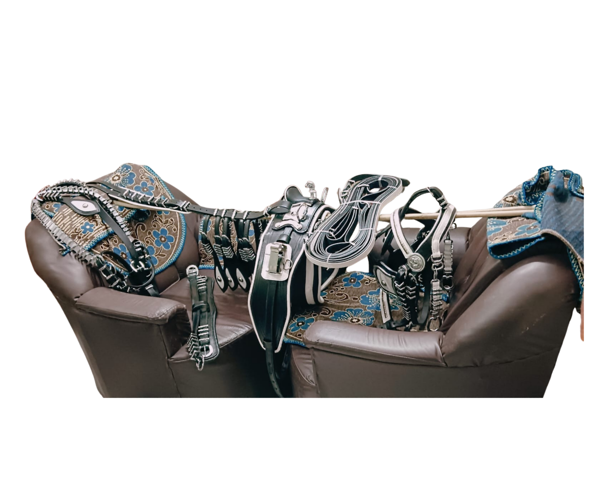 Brown leather chair with decorative horse bridle and reins on a white background