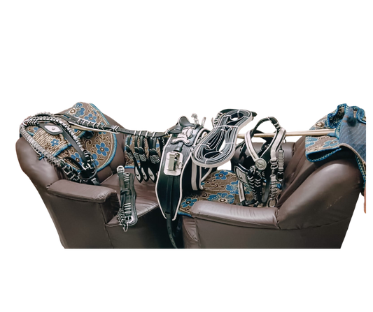 Brown leather chair with decorative horse bridle and reins on a white background