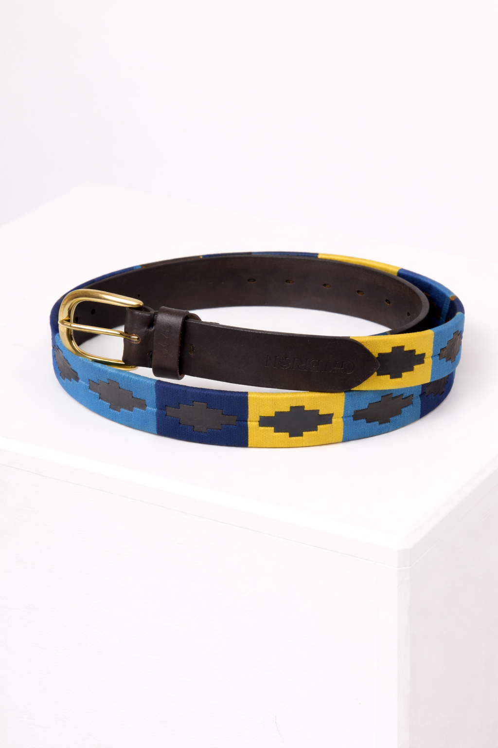 Blue and yellow checkered belt with black buckle on a white background