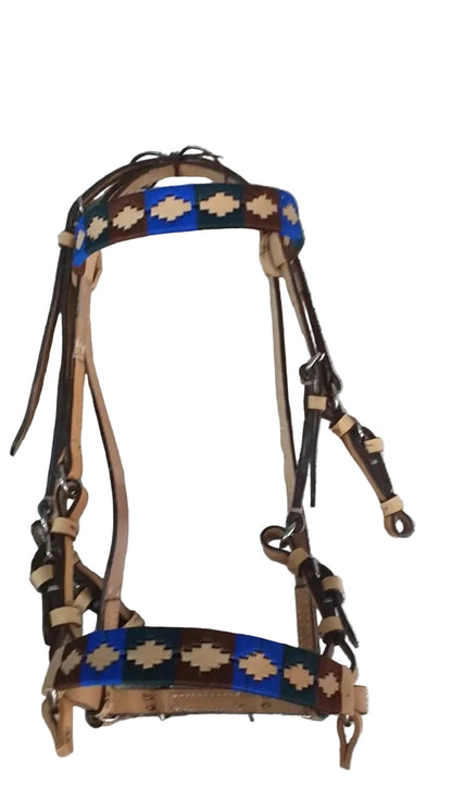 Horse bridle with decorative patterns on a tiled floor