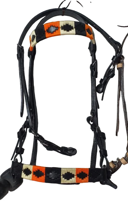 Horse bridle with decorative patterns on a tiled floor